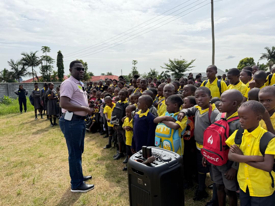Foundation team member speaking with learners during a school engagement